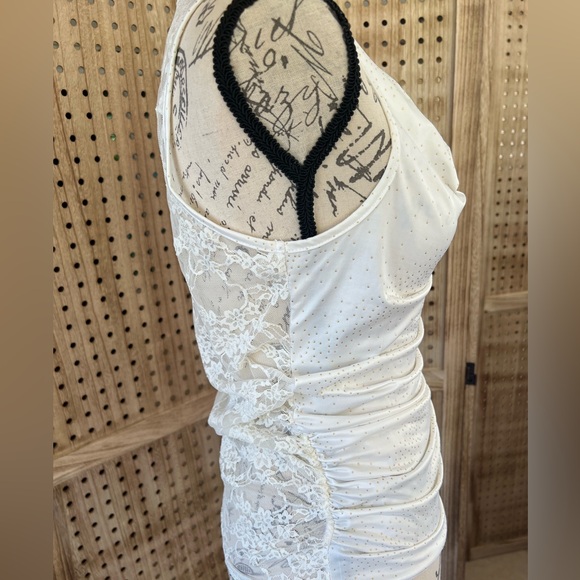 Cream color sleeveless top.Has Gold color Dots and a lace see through back. - Picture 4 of 8